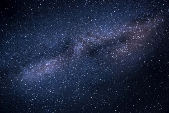 Why can’t we see the far side of the universe? We can’t see the other side of the universe because there hasn’t been enough time since the beginning of the universe for that light to reach us, and the universe is expanding faster than the light can travel.
The first reason we can’t see the other side of the universe is because of the sheer size of the universe and the speed limit of light. There is no way of knowing how big the universe is. The only thing we can know is how big the part of the universe we can see is. The universe began 13.8 billion years ago and it has been expanding ever since. Light from the furthest stars we can see has taken 13.8 billion years to get to us. However, the universe is expanding, so that point that was 13.8 billion light years away from us has moved on. Because the universe is expanding at a calculable rate, that point that we can see from 13.8 billion years ago has moved, and is now 46 billion light years away from us. And if we take our Earth as the center of this observable universe bubble, it is 46 billion light years in every direction, giving a diameter of 92 billion light years. We can see all of the sides of that bubble, but we cannot see any further than that, simply because there hasn’t been enough time in the universe. If we came back and looked at this question in another 10 billion years, (I’ll be waiting for you!), then we would be able to see light from the stars that has taken 23.8 billion light years to get to us. By then the observable universe will be over 200 billion light years in diameter. The reason for that we will get on to in a moment. So, we will never be able to see the far side of the universe because there is not enough time. 
The second reason we can’t see the far side of the universe is because the universe is expanding faster than light can travel. That isn’t to say that the universe is expanding faster than the speed of light. Nothing can go faster than the speed of light. The universe is currently expanding at the rate of 67 km/s/Mpc. Mpc stands for MegaParsec and a megaparsec is 3,260,000 light years. This is an increasing rate, which means the distance between us and other points in the universe increases as the distance increases. So, for the first 3,260,000 light years, the universe expands at a rate of 67 km/s. For the next 3,260,000 light years, it expands at a rate of 134 km/s. And so on. The further away it is, the faster it expands. That means that the light from the far side of the universe will never reach us, no matter how much time it has. It is a little difficult to picture, but the universe is not expanding at the speed of light, and yet it is expanding too fast for light to travel far enough. A good analogy is to imagine an ant walking towards a piece of sugar on an elastic band. The ant is walking at its regular pace, and if nothing happens it will quickly reach the sugar. However, if you start to pull both ends of the elastic band, it will expand. The ant is still walking towards the piece of sugar, but the elastic band is stretching so the distance is increasing. It will now take the ant much longer to reach the sugar because it has much further to go. And if you keep stretching the elastic band forever, the any will never reach the sugar. This is why the light from the other side of the universe will never reach us, no matter how much time there is.  
When we talk about the far side of the universe, there is no way of even knowing if there is a far side. There is no way of knowing if we are near to the center, or near to one of the edges, or even if there is an edge. This is difficult for me to get my head around because I assumed that the Big Bang happened and all of the universe expanded out from that one central point. Wherever that happened must be the center and the farthest edges must be the edge. However, the universe doesn’t have a center. Every part of the universe is expanding away from every other part of the universe in every direction at the same time. And this is what I learned today. 

Sources
https://physics.stackexchange.com/questions/599195/can-light-reach-far-away-galaxies-in-an-expanding-universe
https://en.wikipedia.org/wiki/Observable_universe
https://www.space.com/24073-how-big-is-the-universe.html
https://www.forbes.com/sites/startswithabang/2017/03/24/how-big-was-the-universe-at-the-moment-of-its-creation/?sh=3dec3b8e4cea
https://www.forbes.com/sites/startswithabang/2018/04/28/ask-ethan-how-big-will-the-universe-get/
https://www.reddit.com/r/Astronomy/comments/1joo4sw/kms_per_mpc_explanation/
https://www.wtamu.edu/~cbaird/sq/2013/09/17/where-is-the-center-of-the-universe/
Photo by Pixabay: https://www.pexels.com/photo/photo-of-galaxy-207529/

